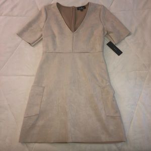 Tan/cream color dress.